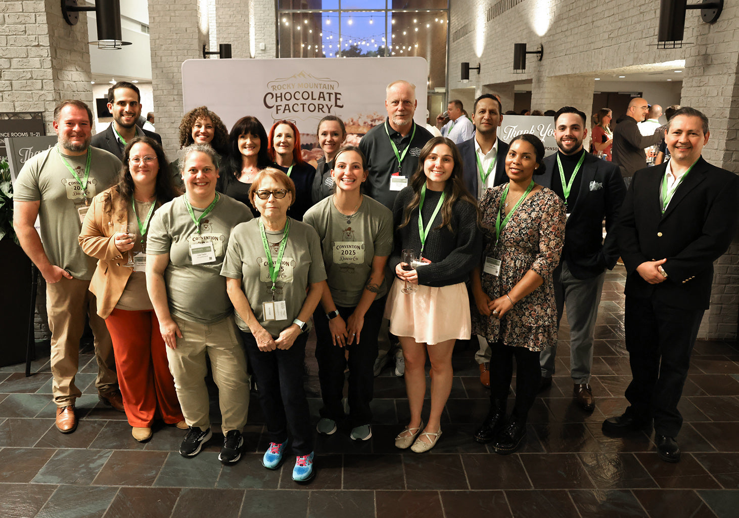 Group photo of Rocky Mountain Chocolate Factory staff at Denver 2025 convention